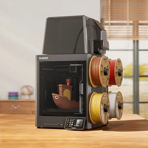 Desktop setup showing Centauri Carbon 2 Combo and four filament spools